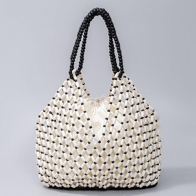 Handmade Woven Beaded Handbag for Women Exquisite Hollow-out Wooden Beaded Shoulder Bag Female Beach Bag 29x27x12cm
Handmade Woven Beaded Handbag for Women Exquisite Hollow-out Wooden Beaded Shoulder Bag Female Beach Bag 29x27x12cm