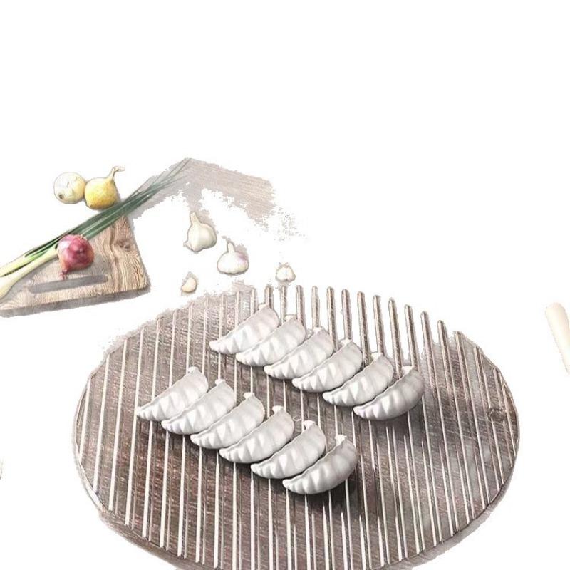 The Dumpling Cover Curtain Is A Wavy Circular Non-stick Dough Dumpling Cover Curtain. A Dumpling Tray Is Placed in The Kitchen for Making Dumplings
The Dumpling Cover Curtain Is A Wavy Circular Non-stick Dough Dumpling Cover Curtain. A Dumpling Tray Is Placed in The Kitchen for Making Dumplings