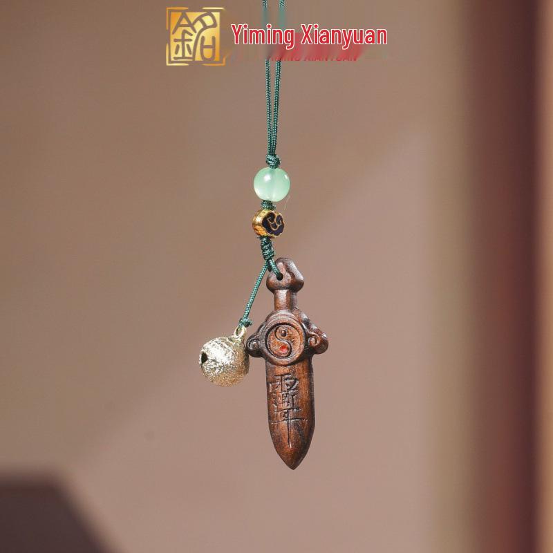 Green Sandalwood Tai Sui Talisman Keychain with Carved Five Sutras and Seven Star Sword Design.
Green Sandalwood Tai Sui Talisman Keychain with Carved Five Sutras and Seven Star Sword Design.