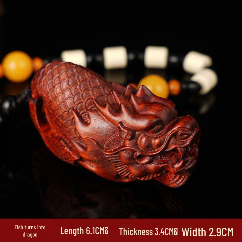 Da Ke Pan Zitan Teapot Handle Wood Carving Ornament
Da Ke Pan Zitan Teapot Handle Wood Carving Ornament