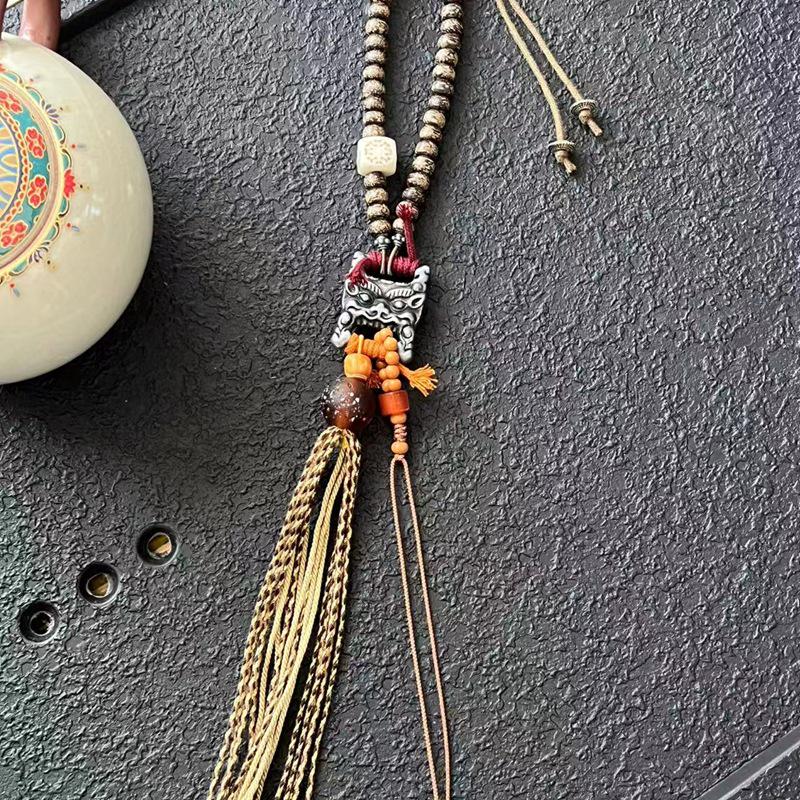 Handmade Coconut Shell Beaded Bag Charm with Tektite, Glass, and Cow Bone Pendant.
Handmade Coconut Shell Beaded Bag Charm with Tektite, Glass, and Cow Bone Pendant.