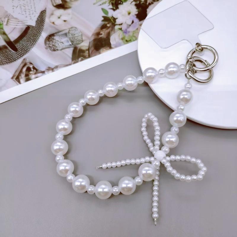 Short mobile phone lanyard with high-end feel, pearl butterfly new wrist strap, beaded phone case, chain bag, keychain pendant білий
Short mobile phone lanyard with high-end feel, pearl butterfly new wrist strap, beaded phone case, chain bag, keychain pendant білий