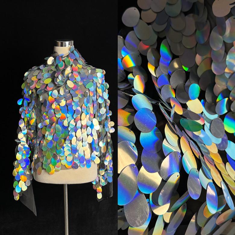 Imported Iridescent Silver Sequin Fabric: 4cm Oval Water Drop Design for Photography Backdrops, Dresses, and Fish Scale Patterns.
Imported Iridescent Silver Sequin Fabric: 4cm Oval Water Drop Design for Photography Backdrops, Dresses, and Fish Scale Patterns.