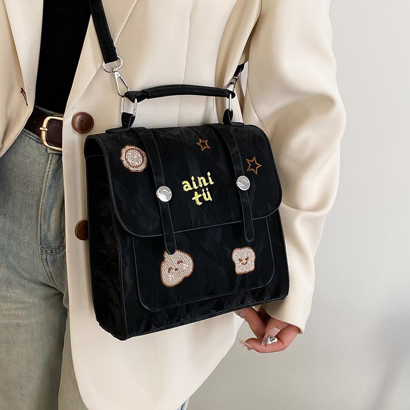 New retro embroidery new college style popular solid color fashion portable shoulder small square bag чорний
New retro embroidery new college style popular solid color fashion portable shoulder small square bag чорний