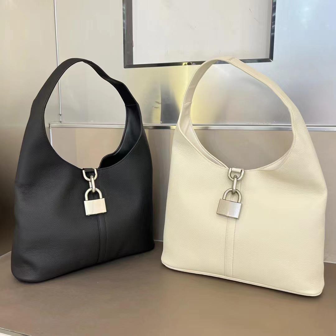 Сумка Baga Classic Minimalist из черно-белой коровьей кожи - Рекомендована модными блогерами для универсального ношения на плече или в руке Small: 23*24*10cm
Сумка Baga Classic Minimalist из черно-белой коровьей кожи - Рекомендована модными блогерами для универсального ношения на плече или в руке Small: 23*24*10cm