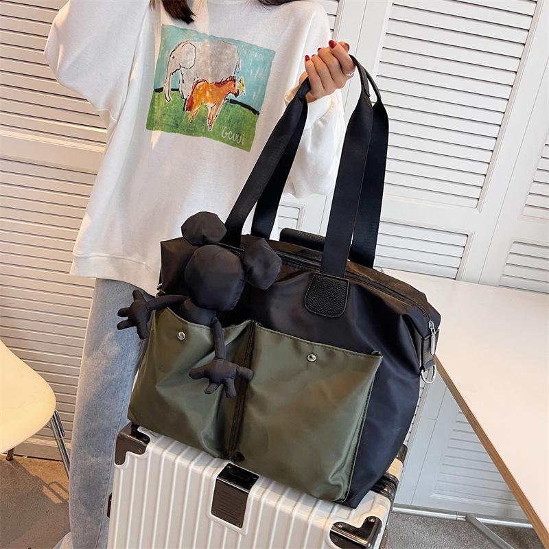New large-capacity pendant Mickey travel bag, short-distance luggage bag, fitness sports bag, trendy cool shoulder handbag.
New large-capacity pendant Mickey travel bag, short-distance luggage bag, fitness sports bag, trendy cool shoulder handbag.