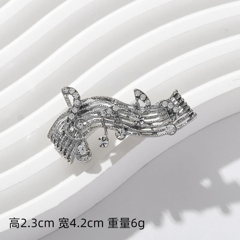 Spring and summer new alloy diamond music symbol brooch femininity high sense fashion music note clothing corsage
Spring and summer new alloy diamond music symbol brooch femininity high sense fashion music note clothing corsage