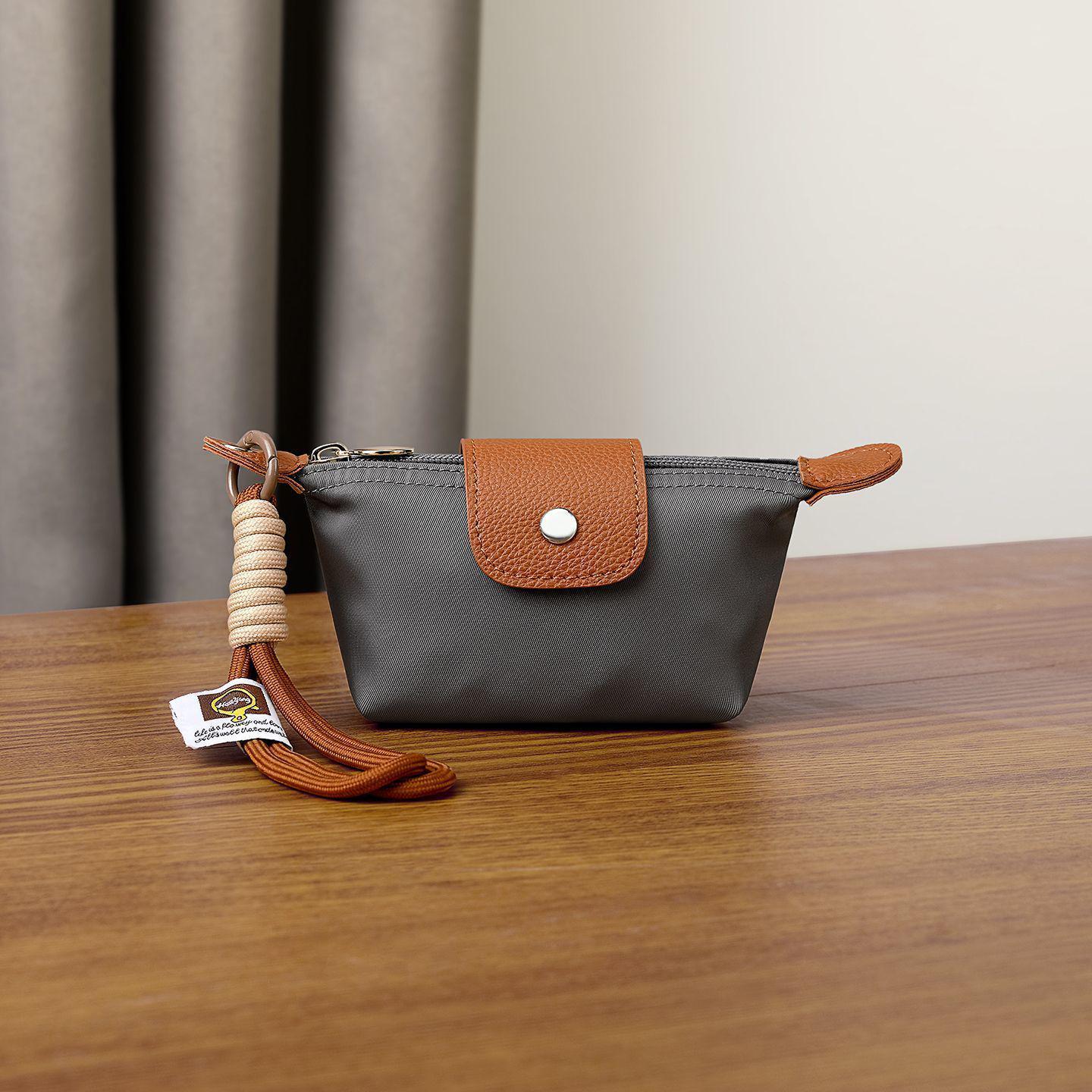 Colorblock Mini Dumpling Bag - Unisex Nylon Coin, Key, Lipstick, and Earphone Holder with Pendant.
Colorblock Mini Dumpling Bag - Unisex Nylon Coin, Key, Lipstick, and Earphone Holder with Pendant.