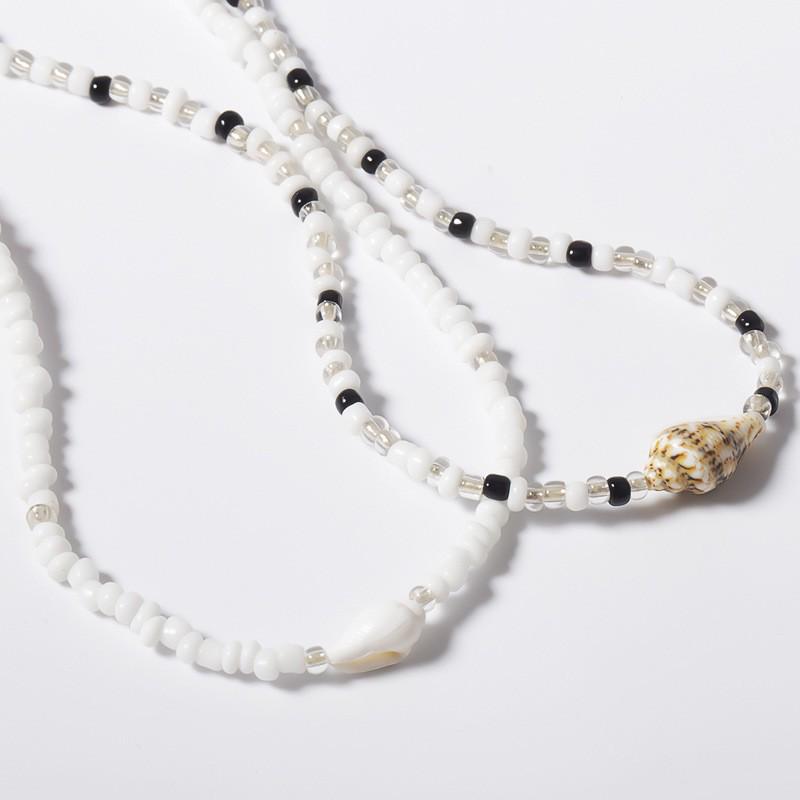 Retro European & American Seashell Rice Bead Necklace Set: Mixed Color, Irregular, Two-Piece, Simple, Unique Design.
Retro European & American Seashell Rice Bead Necklace Set: Mixed Color, Irregular, Two-Piece, Simple, Unique Design.