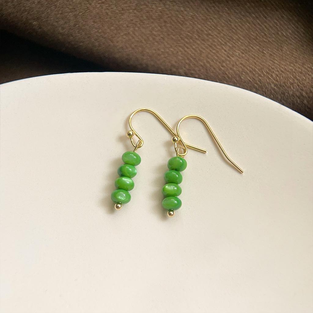 Изумрудные серьги-пусеты в стиле ретро середины века
Изумрудные серьги-пусеты в стиле ретро середины века