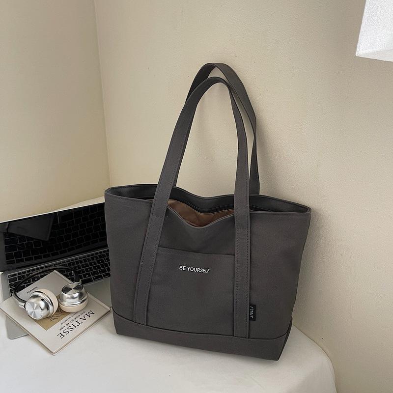 New Winter Stylish Canvas Shoulder Bag with Print Letter for Women Casual Simple Texture Versatile Bags for Travel Handle Bags чорний
New Winter Stylish Canvas Shoulder Bag with Print Letter for Women Casual Simple Texture Versatile Bags for Travel Handle Bags чорний