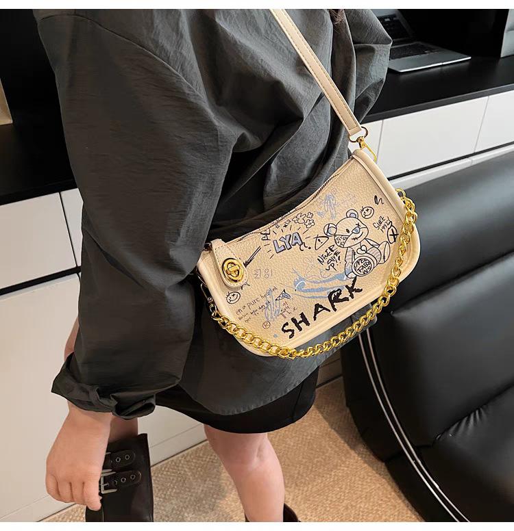 South Korean Cartoon Graffiti Small Bag Women s All-matching One-shoulder Cross-body Texture Commuting Underarm 22x8x13 off білий колір
South Korean Cartoon Graffiti Small Bag Women s All-matching One-shoulder Cross-body Texture Commuting Underarm 22x8x13 off білий колір