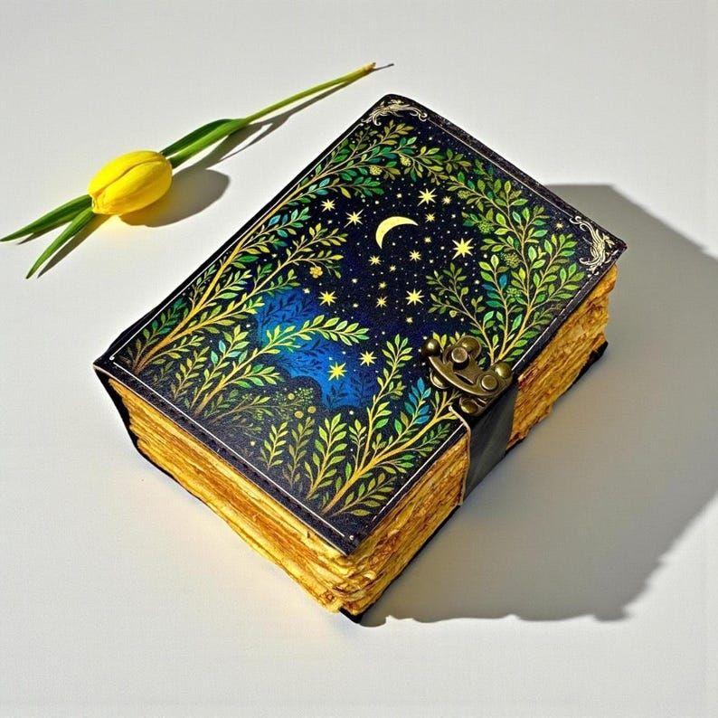 Celestial moon & stars Grimoire journal with vintage pages. Perfect Christmas gift for women who love witchcraft, Wicca, spell work 7 x 5 inch / 100 PAGE
Celestial moon & stars Grimoire journal with vintage pages. Perfect Christmas gift for women who love witchcraft, Wicca, spell work 7 x 5 inch / 100 PAGE