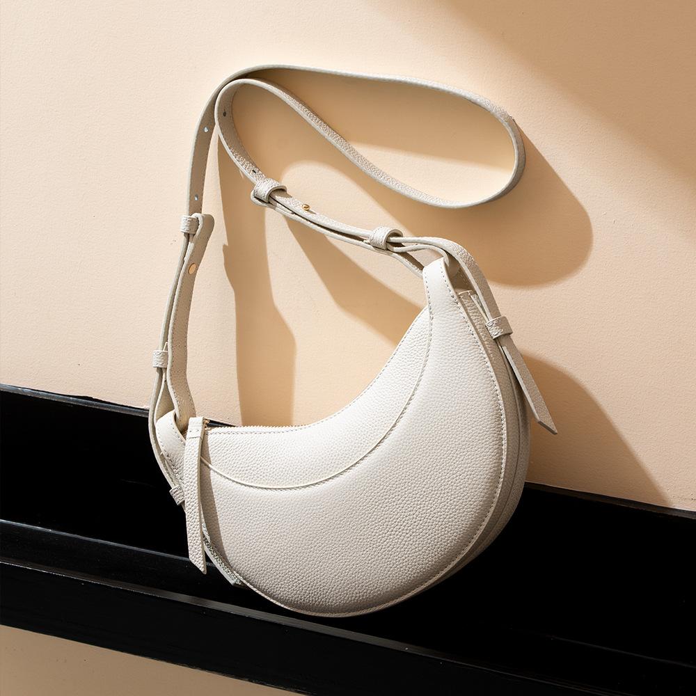 Leather women s bags, fashionable and versatile shoulder bags, high-end niche bags, lychee pattern crescent bags, large-capacity messenger bags.
Leather women s bags, fashionable and versatile shoulder bags, high-end niche bags, lychee pattern crescent bags, large-capacity messenger bags.