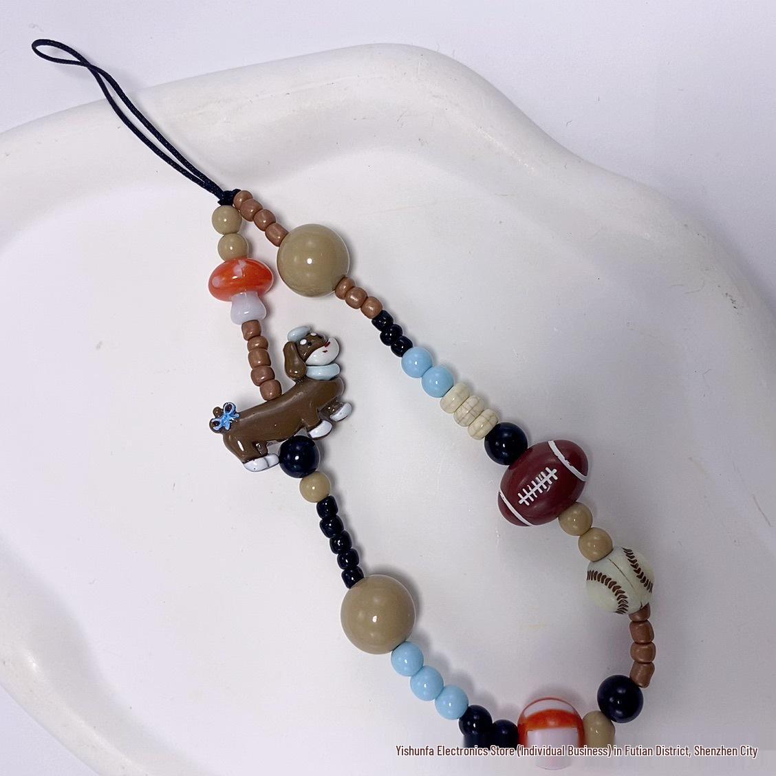 Beaded New Year Cartoon Lanyard: Cute Red Phone, Bag, Key, and Earphone Charm.
Beaded New Year Cartoon Lanyard: Cute Red Phone, Bag, Key, and Earphone Charm.