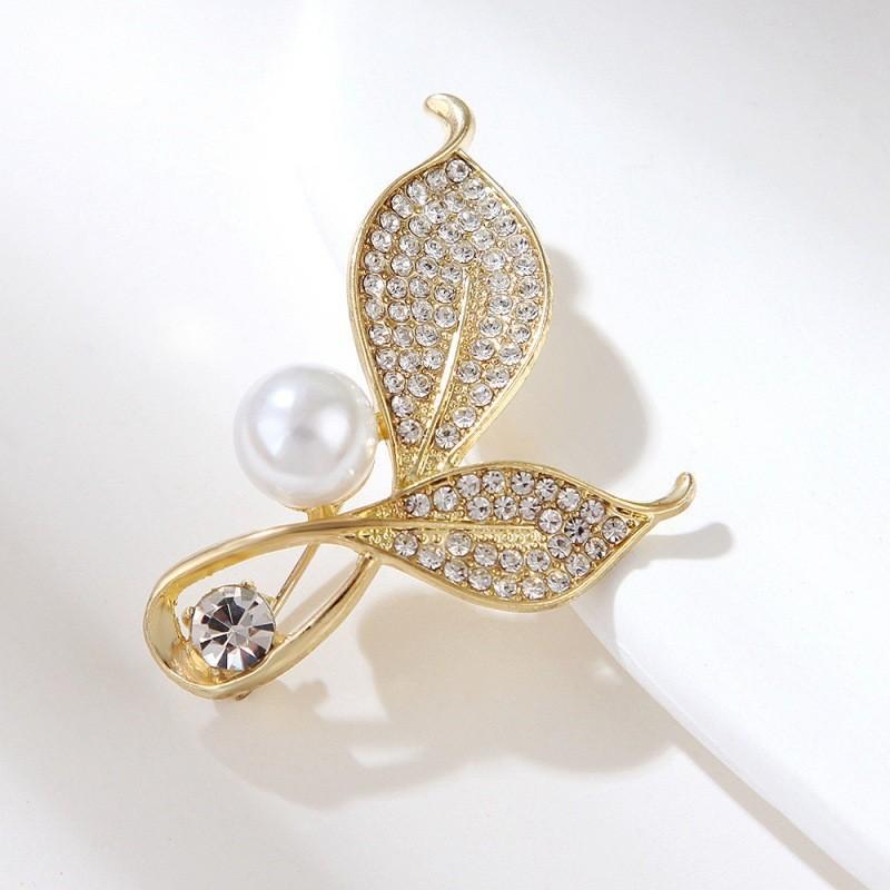Универсальная женская брошь в виде листа из жемчуга, высокого класса, с золотыми стразами, модная элегантная брошь, фиксированная булавка для воротника, противоослепляющая свету
Универсальная женская брошь в виде листа из жемчуга, высокого класса, с золотыми стразами, модная элегантная брошь, фиксированная булавка для воротника, противоослепляющая свету