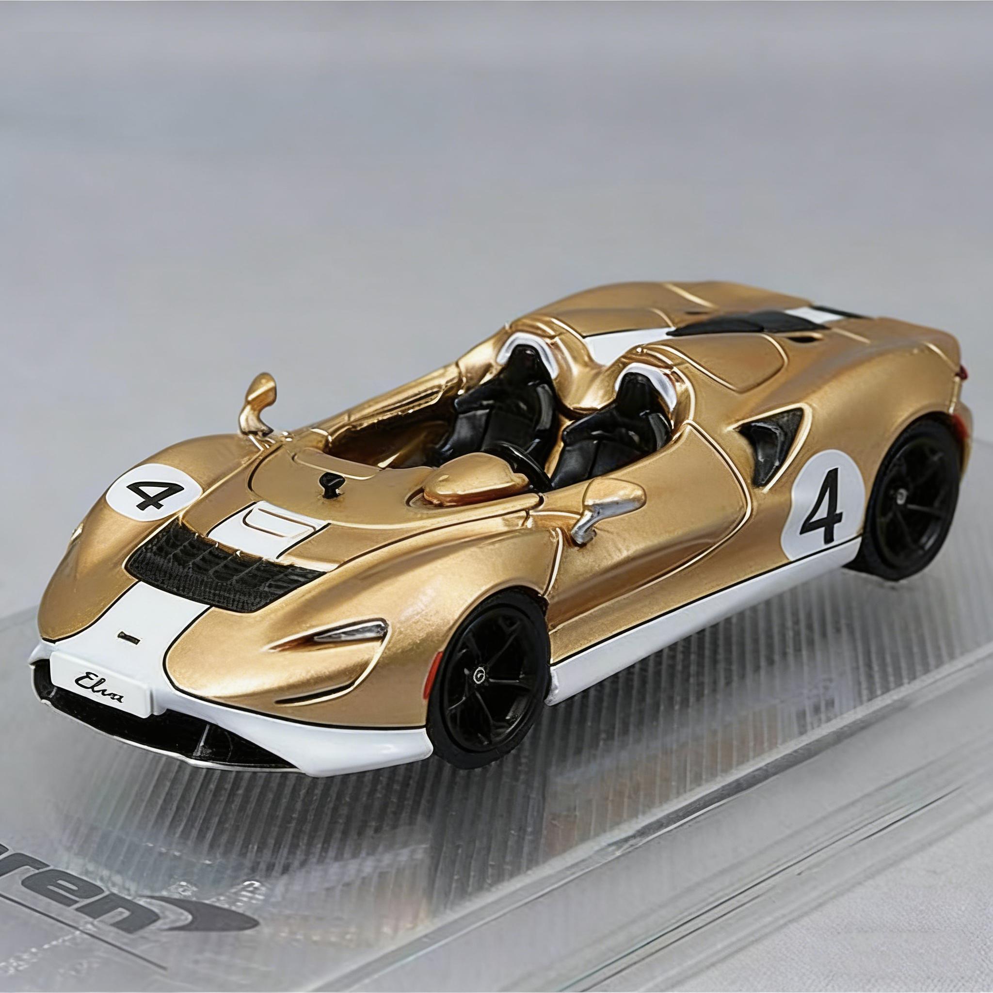 CM Model 1:64 McLaren Elva #4 1967 M6A Can-Am Edition Metallic Gold with White Stripes Diecast Model Car (with extra wheels)
CM Model 1:64 McLaren Elva #4 1967 M6A Can-Am Edition Metallic Gold with White Stripes Diecast Model Car (with extra wheels)
