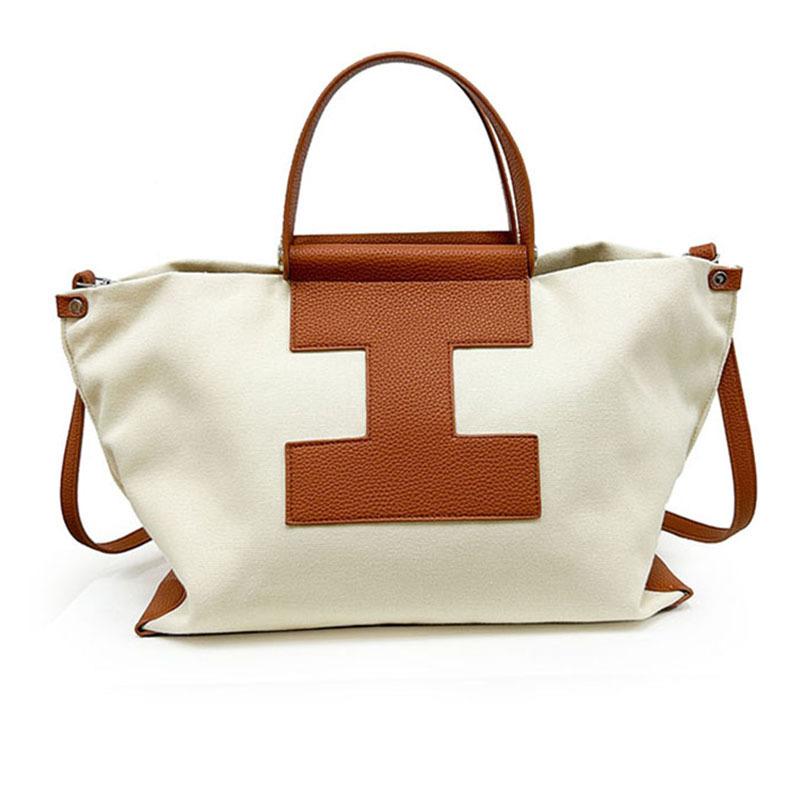 Модная контрастная цветная сумка с вставками. Вместительная сумка для отдыха в форме буквы I. Модная и универсальная сумка для ношения на себе или на работе.