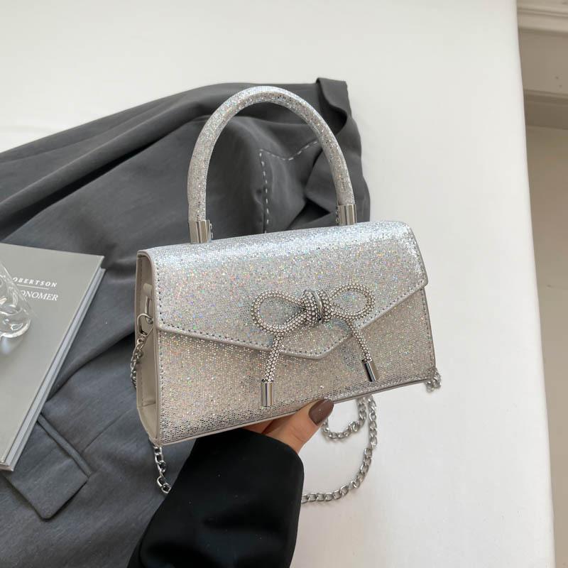 Модная и простая сумочка с бантом в стиле 2025 года, летняя новая сумка через плечо в иностранном стиле, маленькая квадратная сумка серебряный