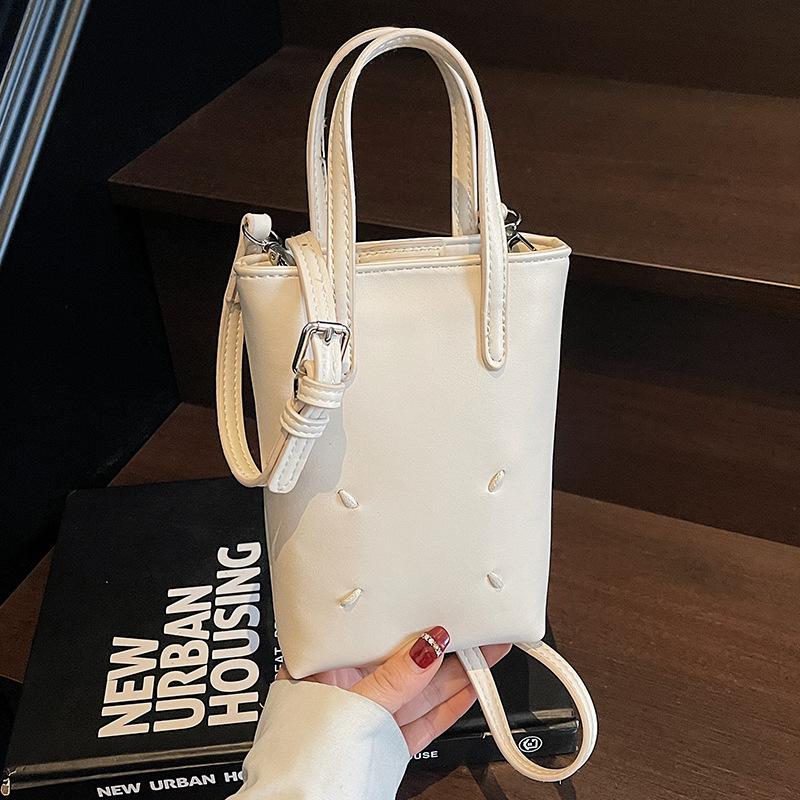 Niche fashion exquisite mobile phone bag female high beauty 2025 new handbag bag solid color popular shoulder crossbody bag белый
Niche fashion exquisite mobile phone bag female high beauty 2025 new handbag bag solid color popular shoulder crossbody bag белый