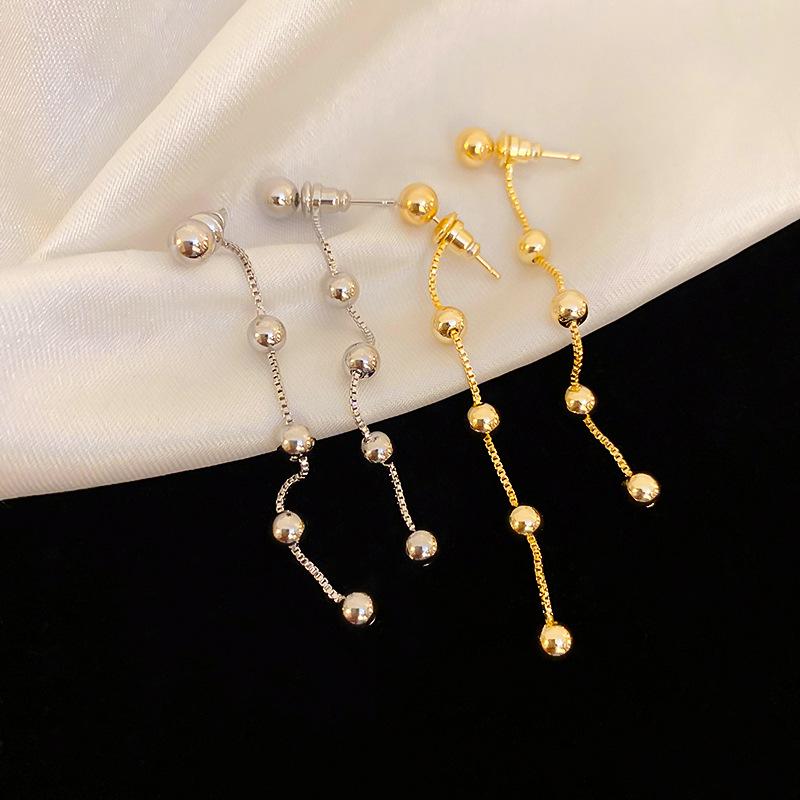 Gold-Plated Geometric Tassel Earrings for Women - Elegant Metallic Beaded Design 
Gold-Plated Geometric Tassel Earrings for Women - Elegant Metallic Beaded Design