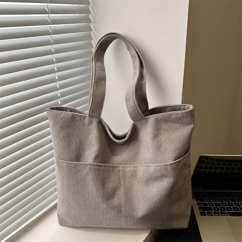Korean large-capacity corduroy bag women s new solid-color handbag literature and art student shoulder women s tote bag сірий колір
Korean large-capacity corduroy bag women s new solid-color handbag literature and art student shoulder women s tote bag сірий колір