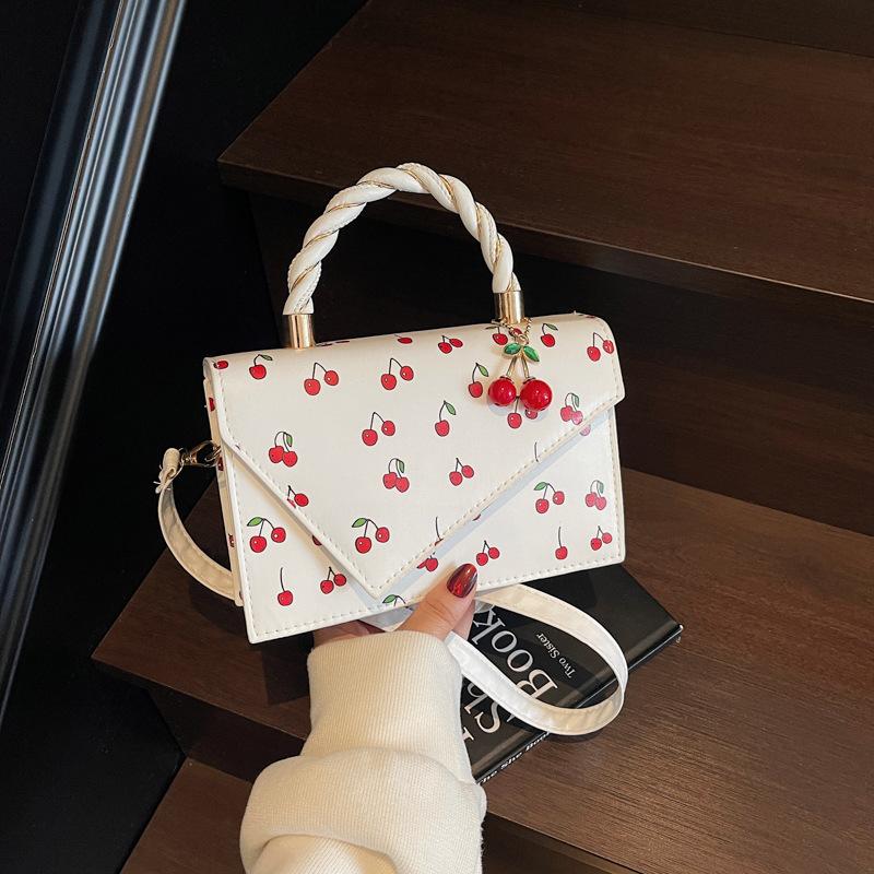 Fresh and sweet handheld small square bag women s bag summer new cherry contrast shoulder bag commuter crossbody bag брудно-білий
Fresh and sweet handheld small square bag women s bag summer new cherry contrast shoulder bag commuter crossbody bag брудно-білий