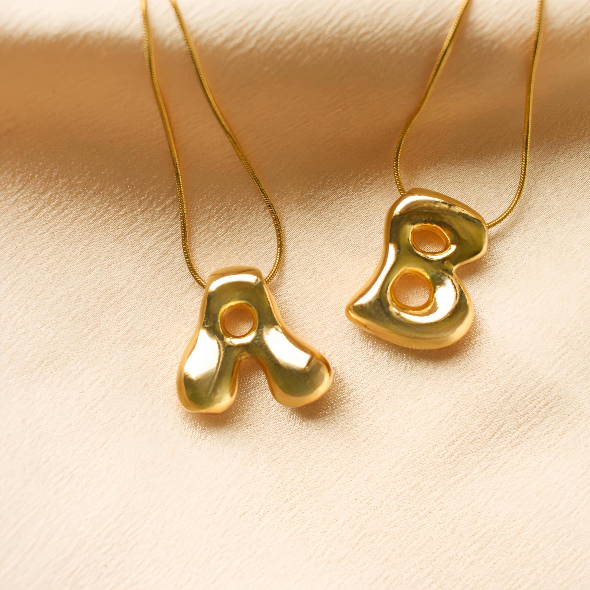 New Style Titanium Steel Plated 18K Gold 26-letter Necklace for Women, Cute Balloon-shaped Chubby Letter Pendant Clavicle Chain A
New Style Titanium Steel Plated 18K Gold 26-letter Necklace for Women, Cute Balloon-shaped Chubby Letter Pendant Clavicle Chain A