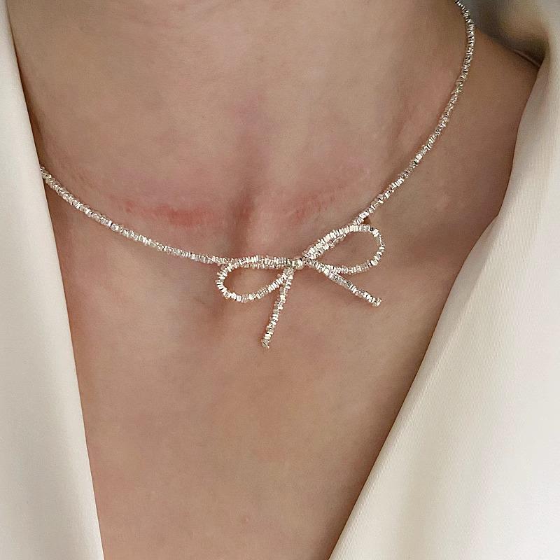 Серебряное ожерелье-бантик с ямочками - Роскошный милый чокер для женщин
Серебряное ожерелье-бантик с ямочками - Роскошный милый чокер для женщин