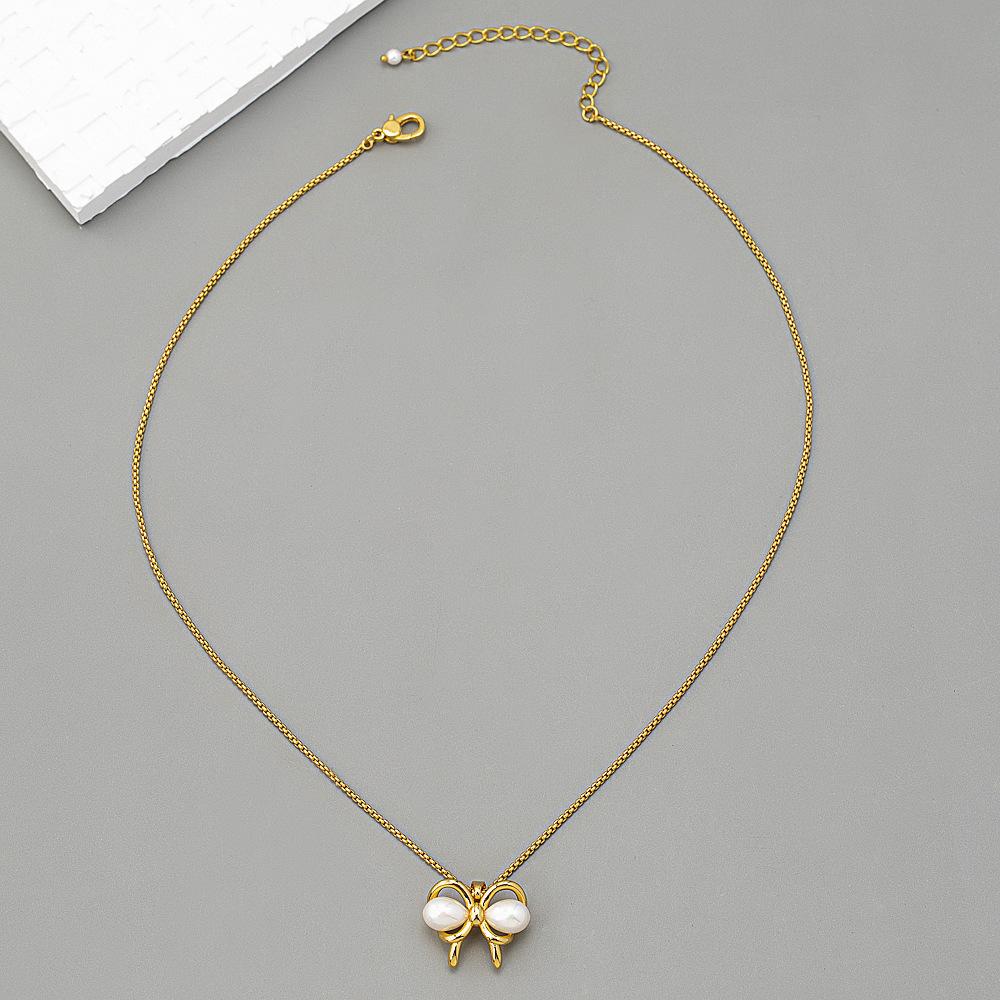 French retro bow pendant with brass 18K gold-plated pearl necklace and accessories for women
French retro bow pendant with brass 18K gold-plated pearl necklace and accessories for women