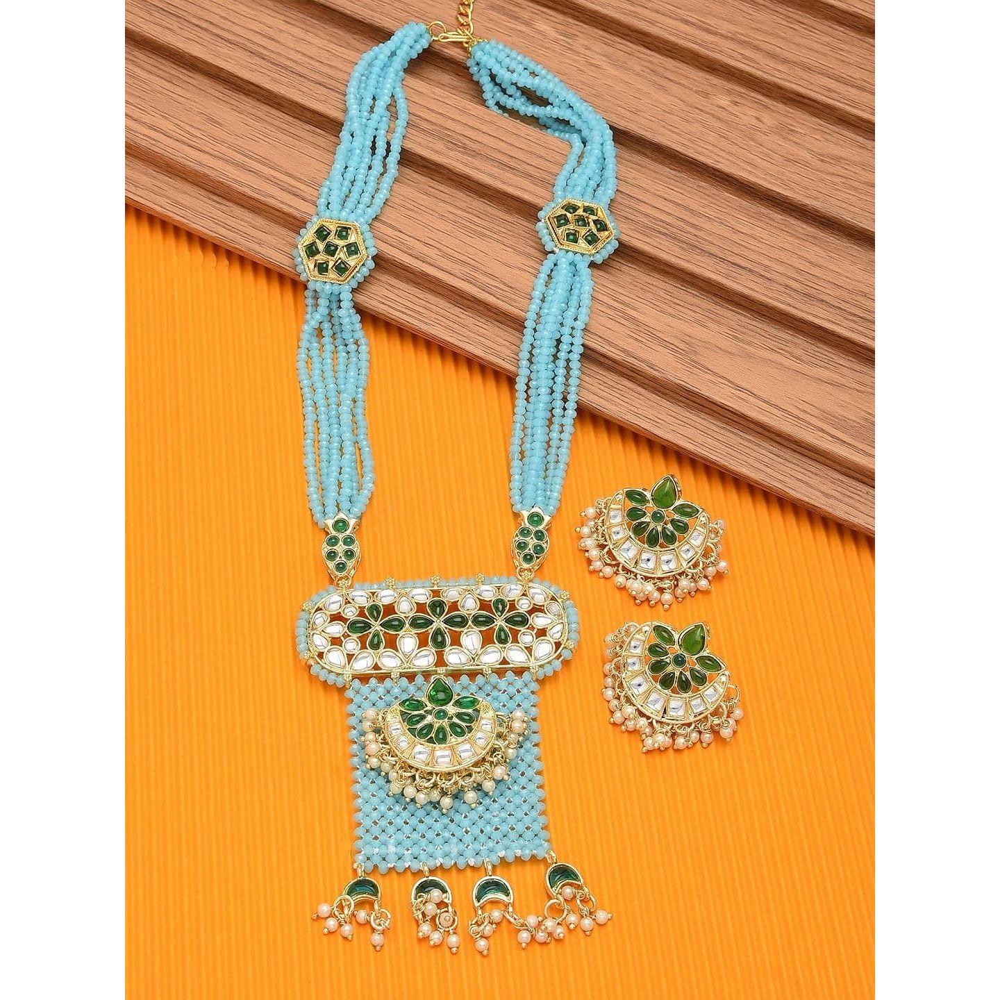 ZAVERI PEARLS Aqua Blue Crystal бисер зеленый комплект ожерелья и серег Kundan для женщин
ZAVERI PEARLS Aqua Blue Crystal бисер зеленый комплект ожерелья и серег Kundan для женщин