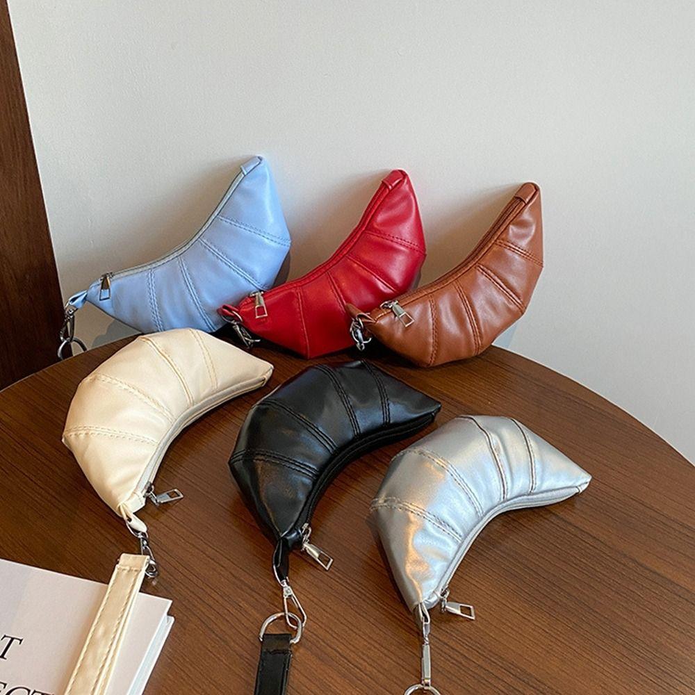 Mini PU Croissant Bag Silver Earphone Bag Elegant Hanging Neck Coin Purse Outdoor срібний
Mini PU Croissant Bag Silver Earphone Bag Elegant Hanging Neck Coin Purse Outdoor срібний