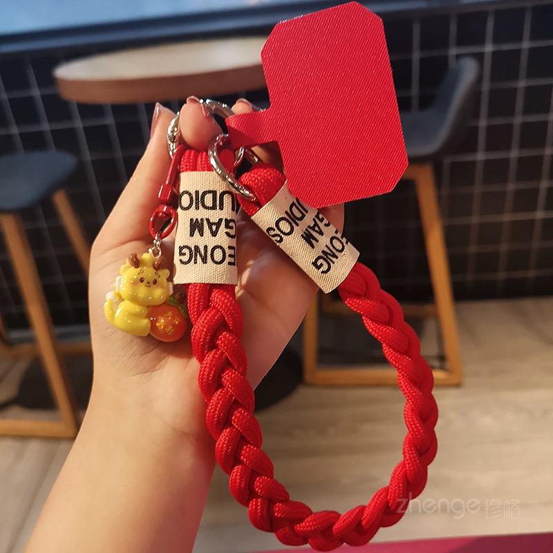 Red three-stranded ponytail hand rope ins women s mobile phone lanyard portable wrist short auspicious dragon pendant
Red three-stranded ponytail hand rope ins women s mobile phone lanyard portable wrist short auspicious dragon pendant