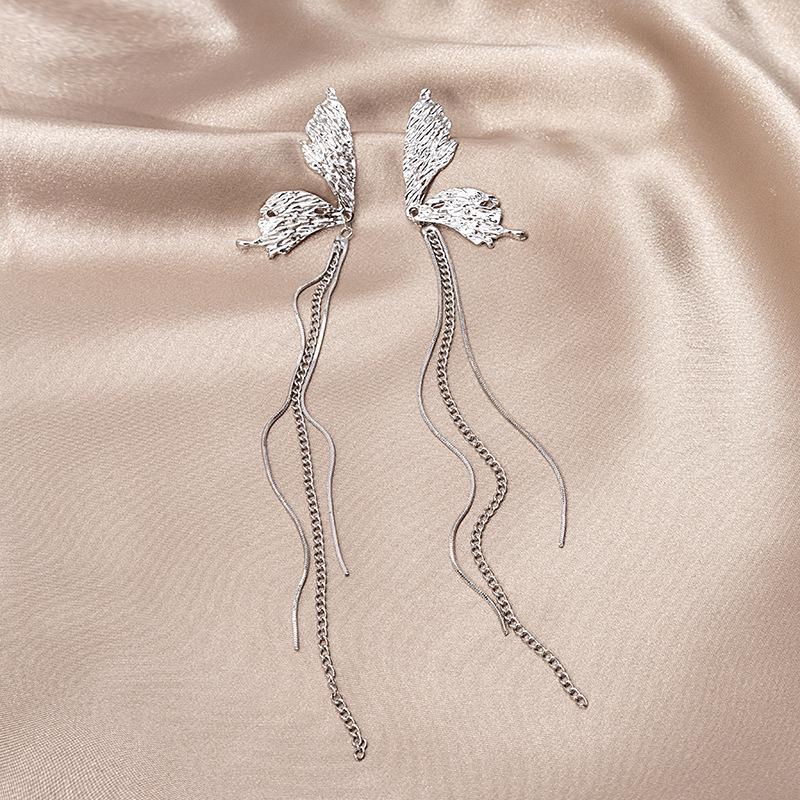Silver Needle Asymmetrical Butterfly Tassel Earrings with Concave-Convex Texture and Long Stud Design
Silver Needle Asymmetrical Butterfly Tassel Earrings with Concave-Convex Texture and Long Stud Design
