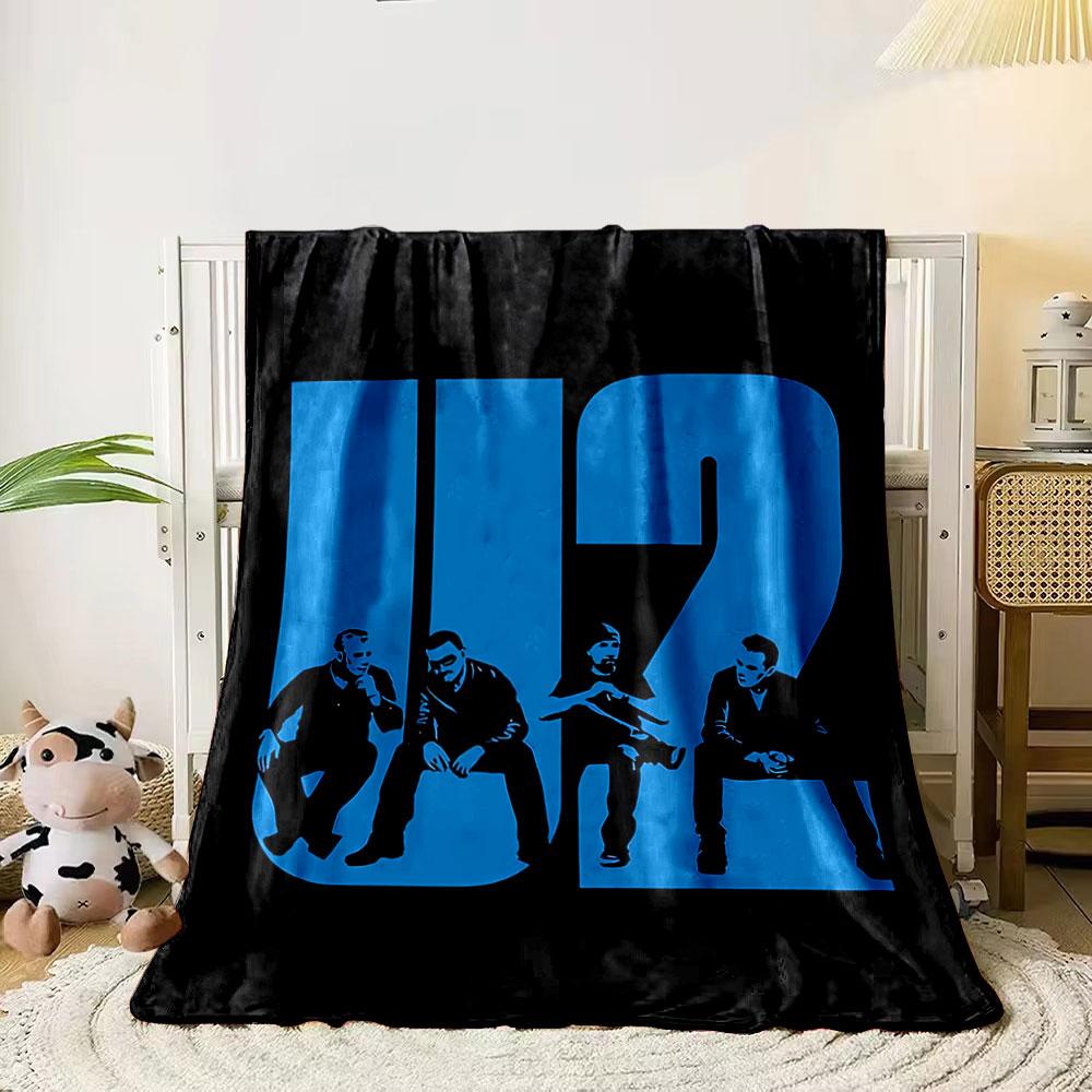 Large blue U2 text incorporating silhouettes of four seated individuals. for all seasons blanket lunch break throw gift 80cm x 120cm
Large blue U2 text incorporating silhouettes of four seated individuals. for all seasons blanket lunch break throw gift 80cm x 120cm
