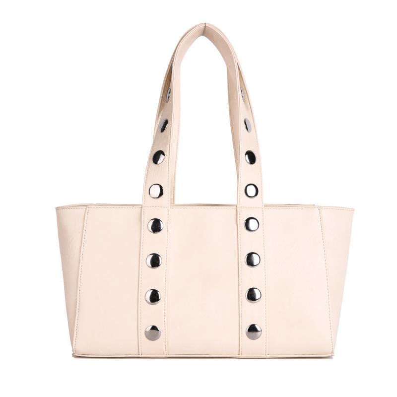 European and American trend rivets large capacity tote bag temperament versatile bag women s simple high-end shoulder bag handbag
European and American trend rivets large capacity tote bag temperament versatile bag women s simple high-end shoulder bag handbag