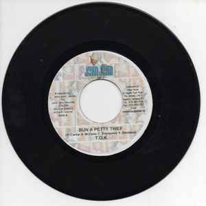 7inch Record T.O.K. - Bun A Petty Thief NONE John John Recor 2005 Jamaica Reggae, Ska & Dub Used
7inch Record T.O.K. - Bun A Petty Thief NONE John John Recor 2005 Jamaica Reggae, Ska & Dub Used
