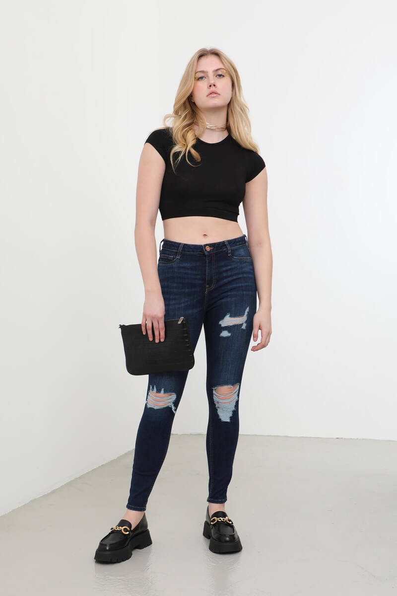 Женские рваные джинсы скинни из лайкры с деталями темно-синего цвета
Женские рваные джинсы скинни из лайкры с деталями темно-синего цвета