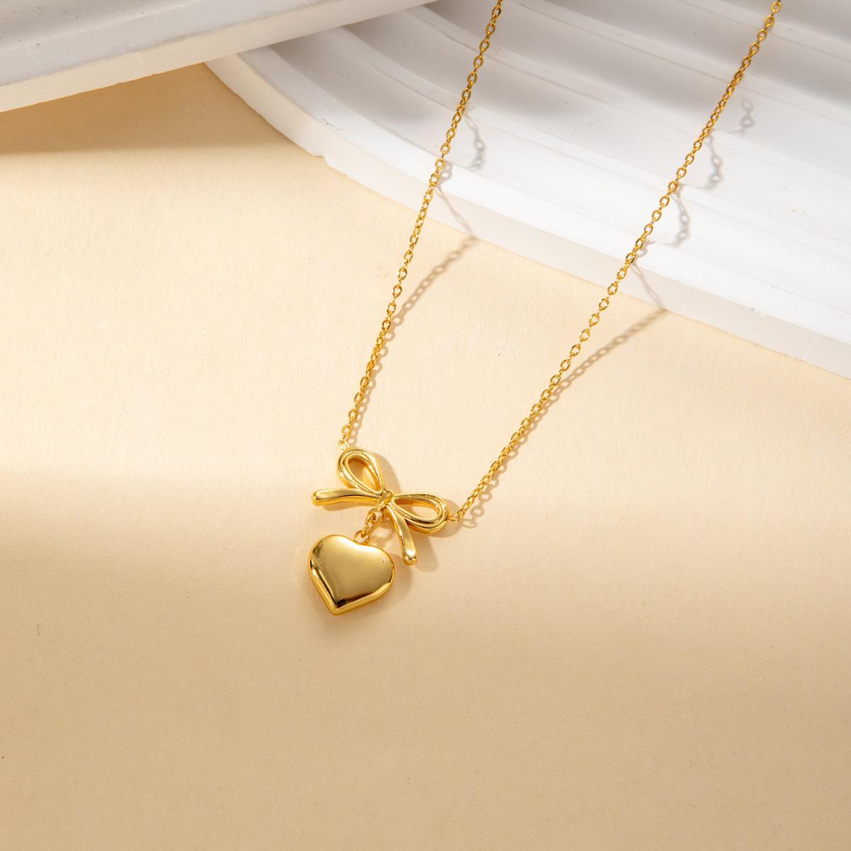 Elegant Gold Bow & Peach Heart Necklace and Earrings Set for Women - Stainless Steel Chain
Elegant Gold Bow & Peach Heart Necklace and Earrings Set for Women - Stainless Steel Chain