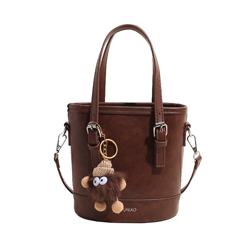 Осень и зима ретро сумка-тоут женская новая модная универсальная на плечо, кроссбоди, премиальная сумка-ведро no pendant коричневый
Осень и зима ретро сумка-тоут женская новая модная универсальная на плечо, кроссбоди, премиальная сумка-ведро no pendant коричневый