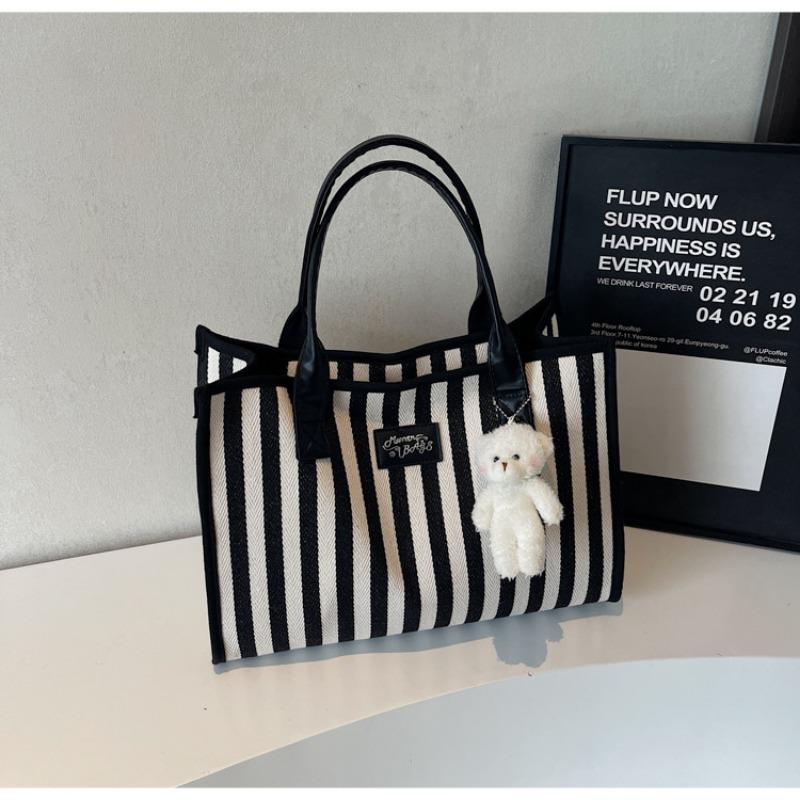 Retro literary and simple small fresh stripes casual fashion large capacity shoulder portable tote women s bag чорний
Retro literary and simple small fresh stripes casual fashion large capacity shoulder portable tote women s bag чорний