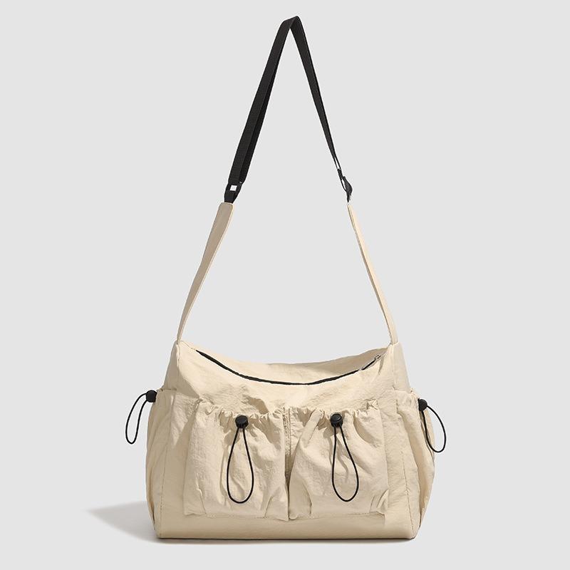 Bag women s large-capacity new summer niche one-shoulder messenger bag, high-end student class tote bag хакі
Bag women s large-capacity new summer niche one-shoulder messenger bag, high-end student class tote bag хакі