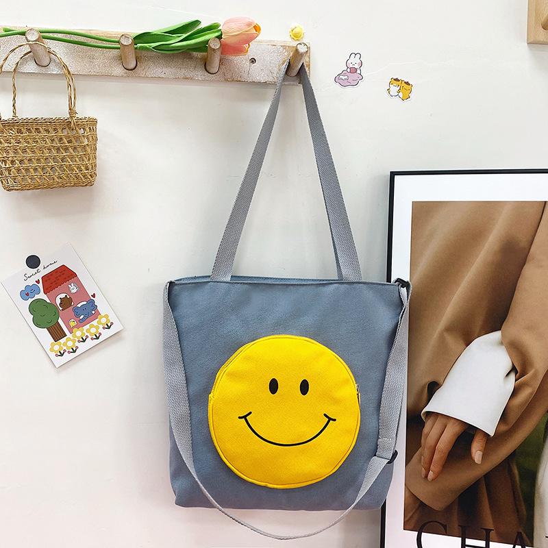 Холщовая сумка большой вместимости, студенческая сумка для покупок, ручная сумка, холщовая сумка в стиле колледжа с принтом смайлика, сумка для репетитора
Холщовая сумка большой вместимости, студенческая сумка для покупок, ручная сумка, холщовая сумка в стиле колледжа с принтом смайлика, сумка для репетитора
