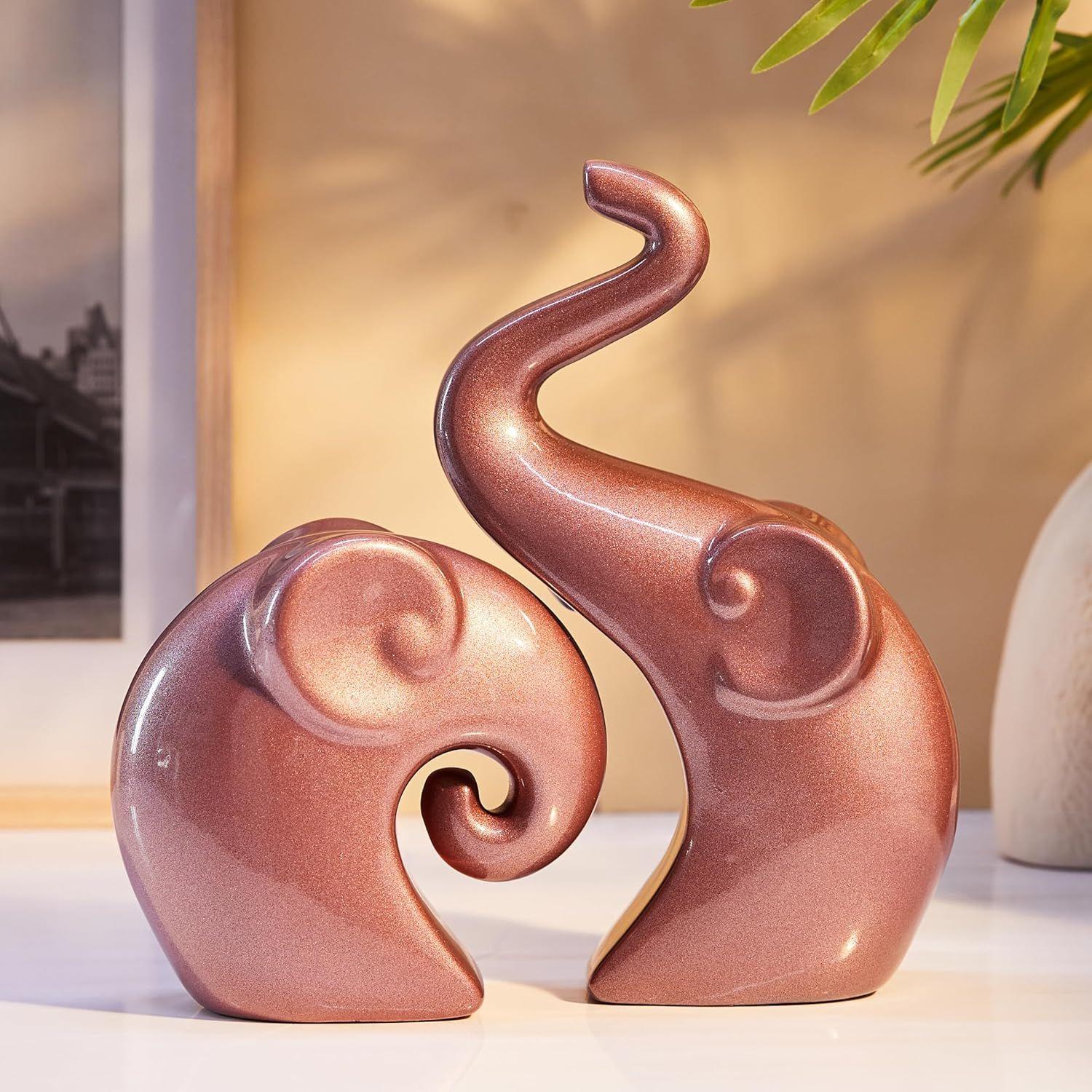 Lavish Rose Gold Home Decor Elephant Couple | Ceramic Figurines (Set of 2, Matte Rose Gold)
Lavish Rose Gold Home Decor Elephant Couple | Ceramic Figurines (Set of 2, Matte Rose Gold)