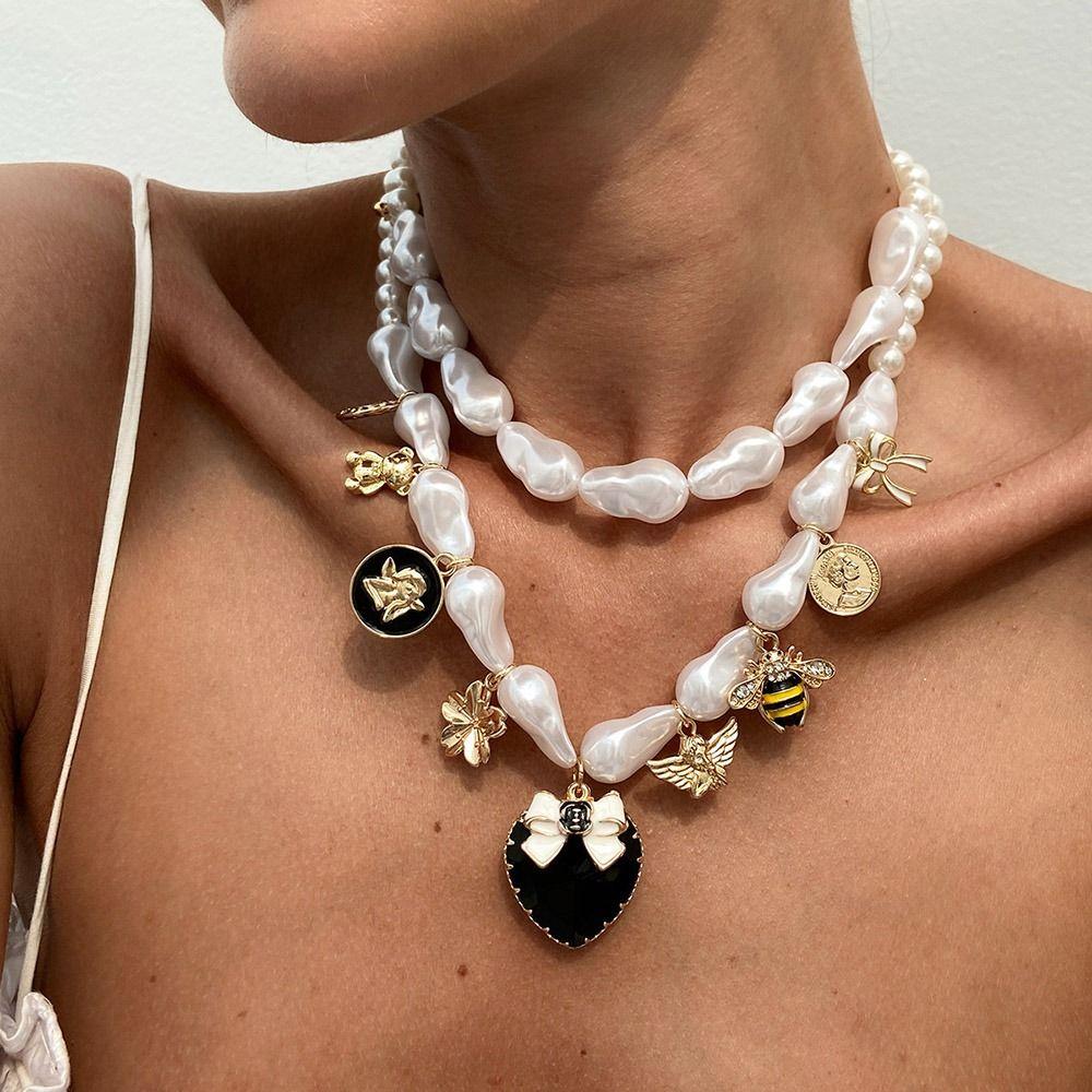 Double-layer Bow Heart Pendant Necklace Imitation Pearl Clavicle Chain Girls Necklace
Double-layer Bow Heart Pendant Necklace Imitation Pearl Clavicle Chain Girls Necklace