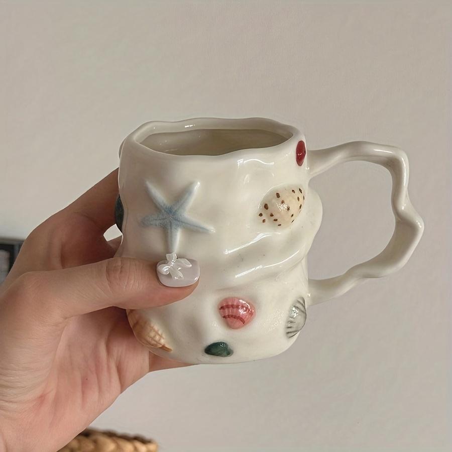 1pc 300ml/10oz Creative Shell Pattern Ceramic Coffee Mug, Hand-painted Ceramic Tea Cup Matcha Cup, Beautiful Pattern Couple Cup, 200-400ml
1pc 300ml/10oz Creative Shell Pattern Ceramic Coffee Mug, Hand-painted Ceramic Tea Cup Matcha Cup, Beautiful Pattern Couple Cup, 200-400ml