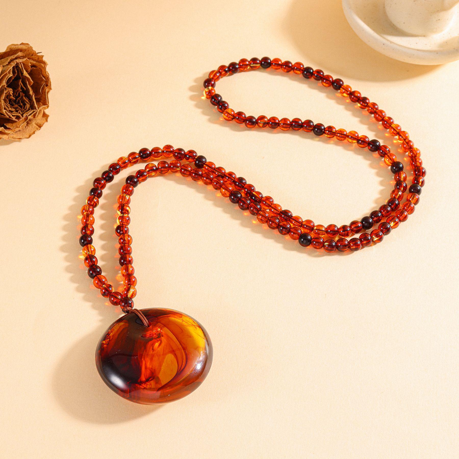 Blood Vein Amber Necklace - Faux Blood Amber and Beeswax with Cloud Pattern Wushi Pai Pendant.
Blood Vein Amber Necklace - Faux Blood Amber and Beeswax with Cloud Pattern Wushi Pai Pendant.
