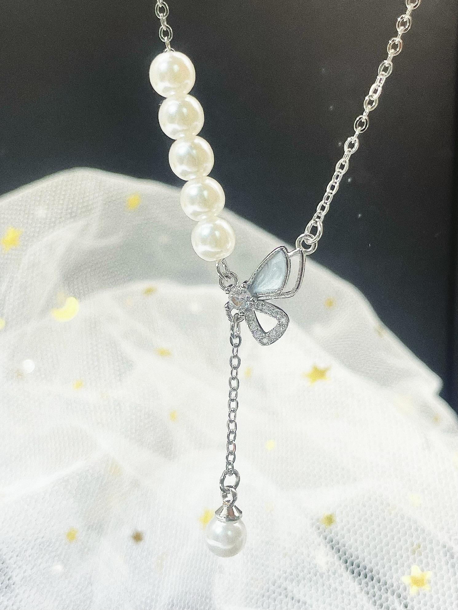 Silver-Plated Butterfly Pearl Tassel Necklace Elegant Cat s Eye Stone Lockbone Chain Feminine Chic Gift for Girlfriend 48cm
Silver-Plated Butterfly Pearl Tassel Necklace Elegant Cat s Eye Stone Lockbone Chain Feminine Chic Gift for Girlfriend 48cm