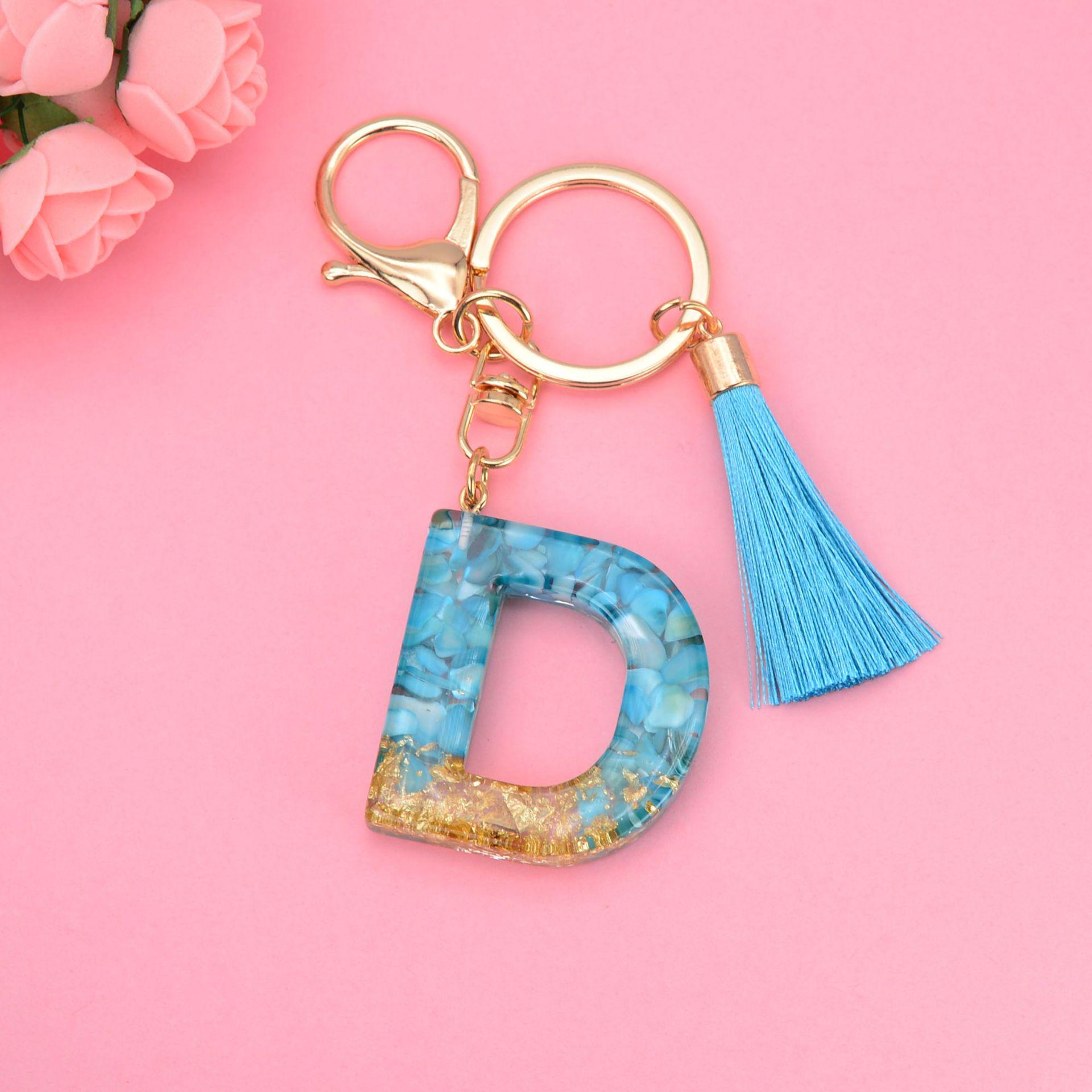 Синий брелок с кисточкой и 26 подвесками в виде английских букв - подвеска-капля из смолы для сумок и автомобилей, унисекс.
Синий брелок с кисточкой и 26 подвесками в виде английских букв - подвеска-капля из смолы для сумок и автомобилей, унисекс.