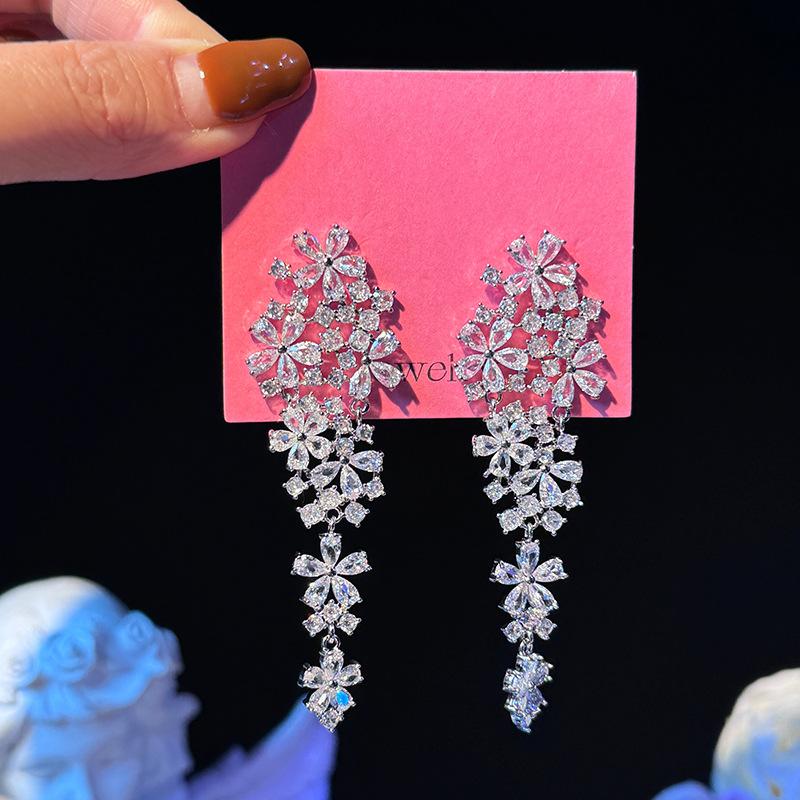 Zircon hollow flower fringed earrings exquisite light luxury high-end earrings niche versatile fashion earrings women
Zircon hollow flower fringed earrings exquisite light luxury high-end earrings niche versatile fashion earrings women
